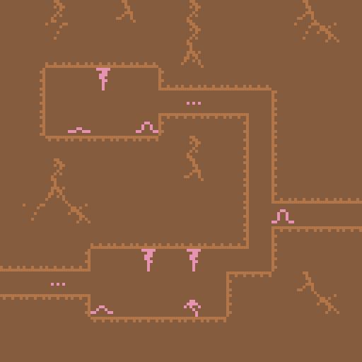 Tiny pink worms inhabit a pixelated subterranean network of caves. One of the worms is wiggling.